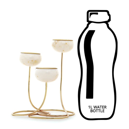 Trilight white marble tea light holders in comparison to a 1l water
