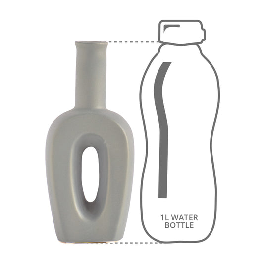 Grey hollow linear ceramic vase height comparison with a 1l bottle