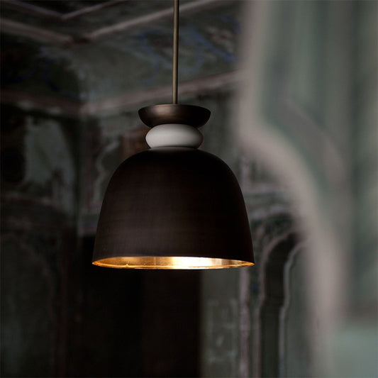 black pendant light in the shape of a bell