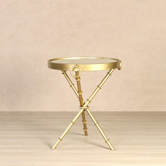 Table with mirror top and tripod legs