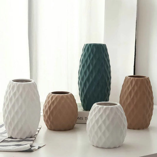 Five Delilah ceramic vases in different shapes and colours