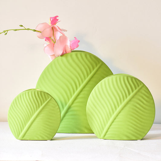 Three sized mint green vases in ceramics