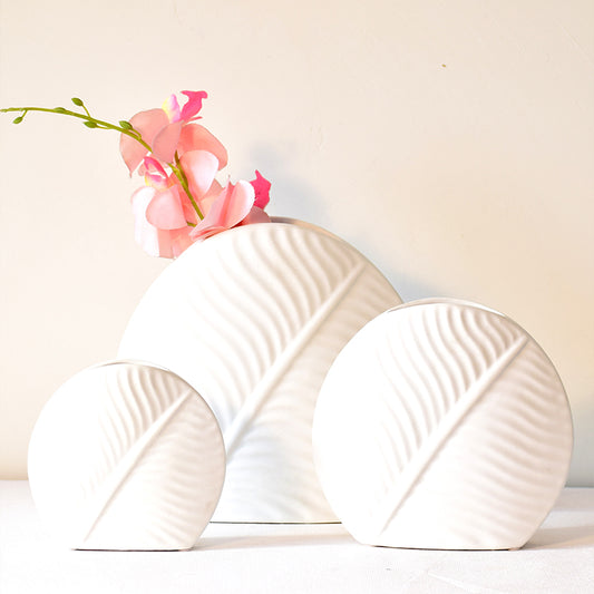 Three sized white vases in ceramics