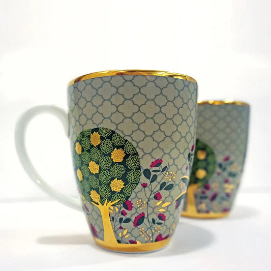 Birds, tree, and lotus motifs on a mug