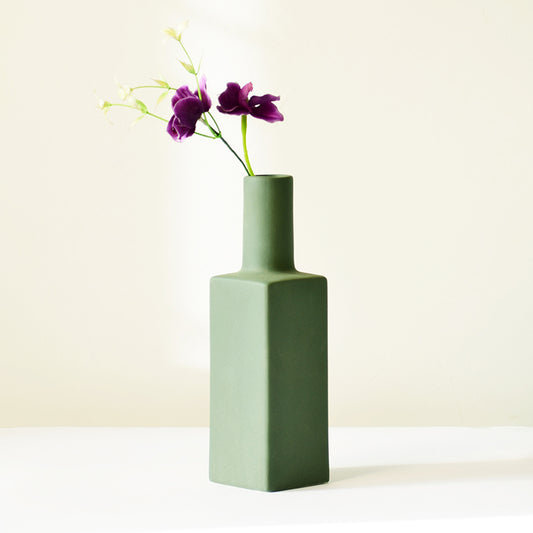 Bottle shaped dark green flower vase