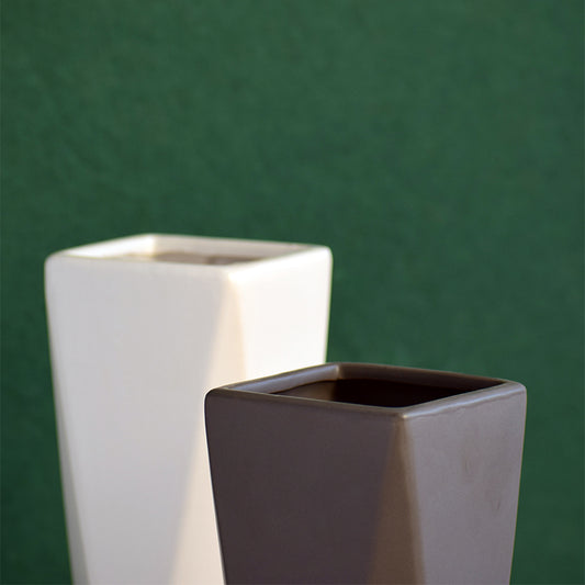 Two geometric ceramic vases close up