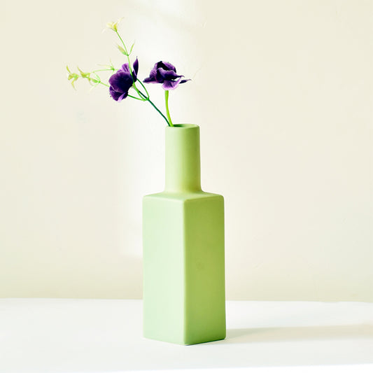 Bottle shaped mint green vase with flowers