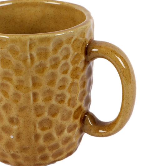 Ochre ceramic milk mug close up