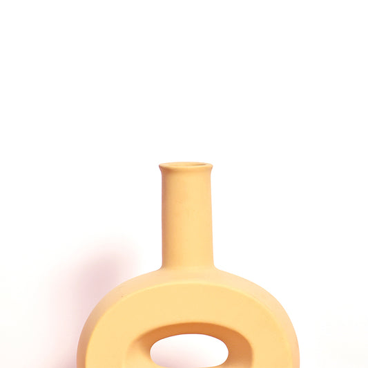 hollow flat ginger ceramic vase close up