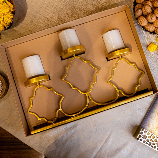Three golden candle light holder in a gift box